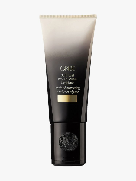 Oribe Gold Lust Repair & Restore Conditioner white to black gradient tube on light gray background