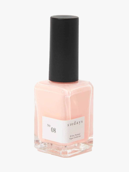 Sundays Nail Polish in No.08 bottle of light peach nail polish with black cap on light gray background